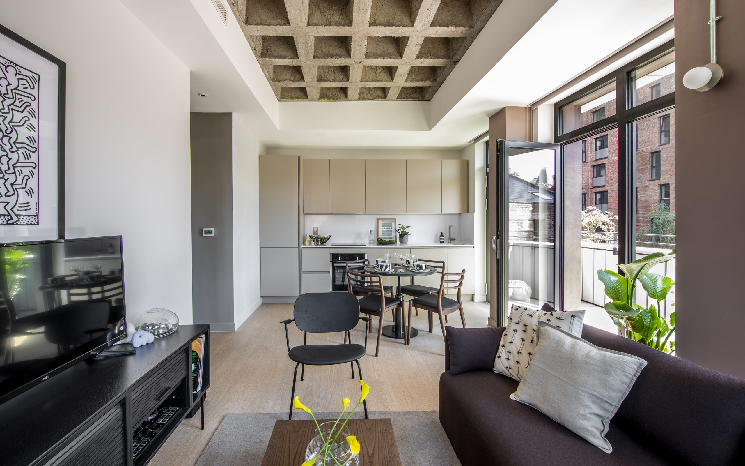 Open living dining and kitchen space inside of apartment