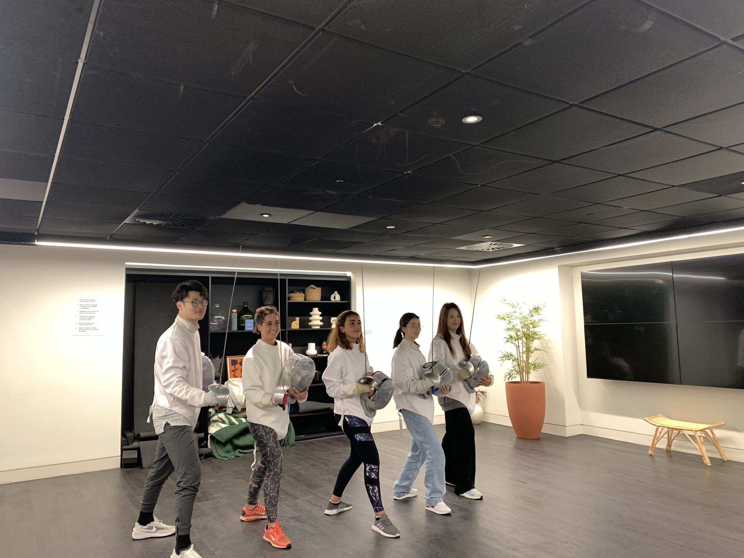 A group fencing session takes place in the Kampus Gymnasium